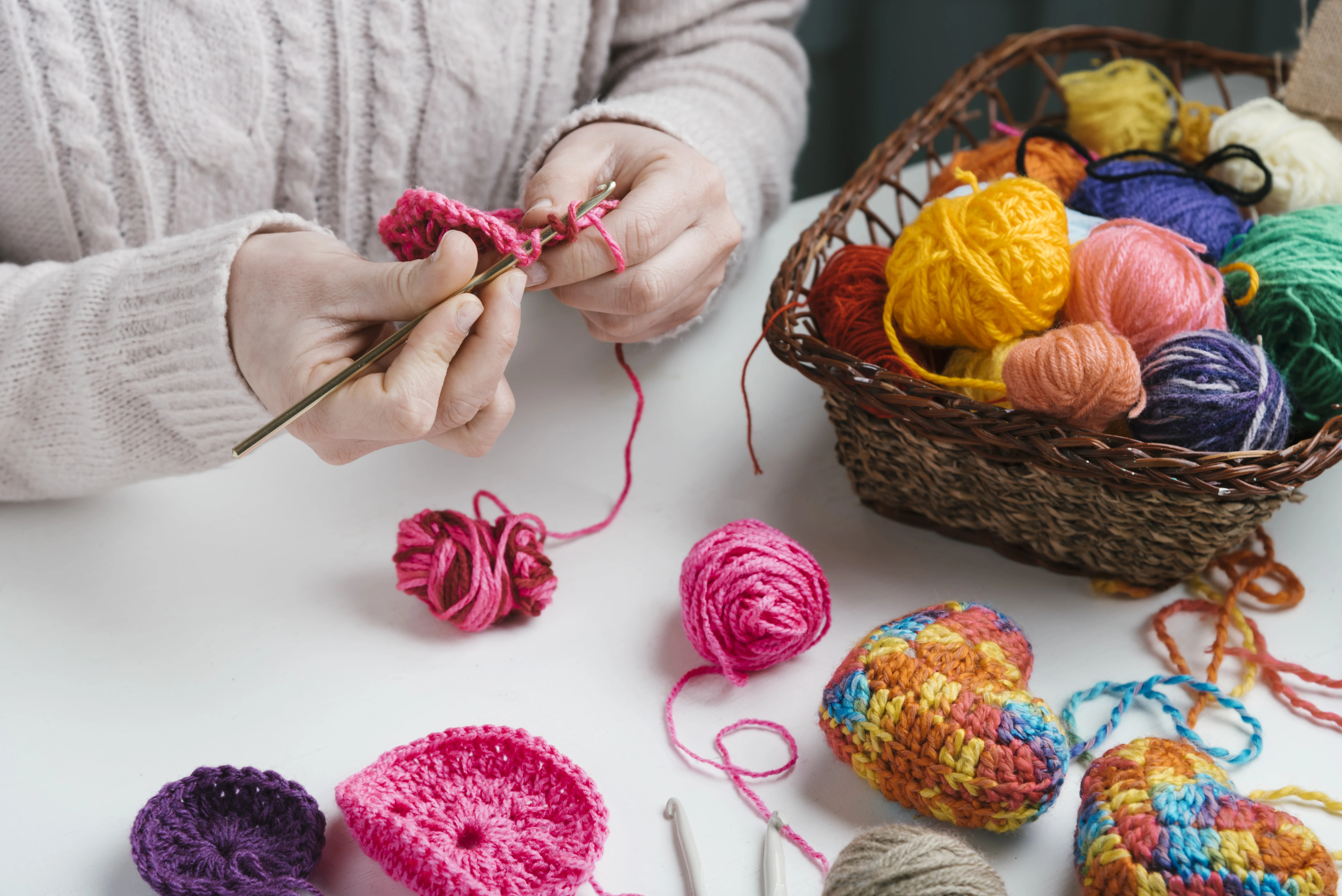 Granddaughter creating handmade knitted pieces